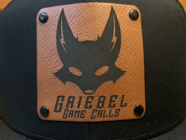 A leather patch with the name of a game call.