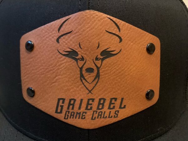 A leather patch with the name of gaiebel game calls on it.